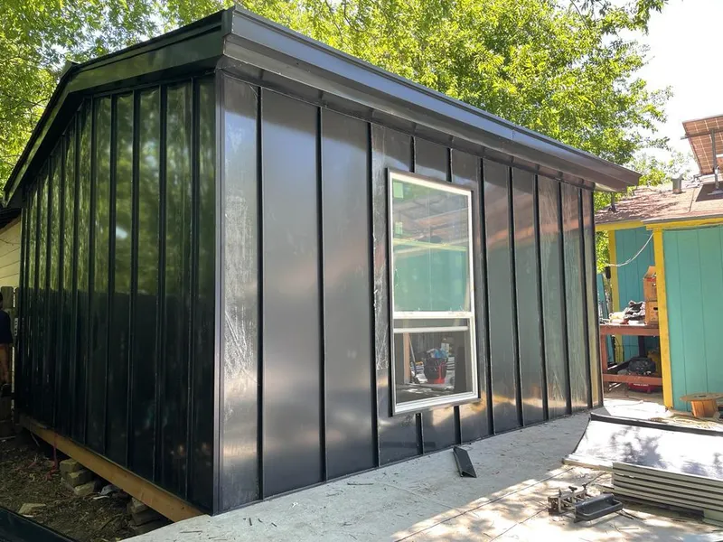 Black standing seam metal wall panels for Roof Inspection in Maryville